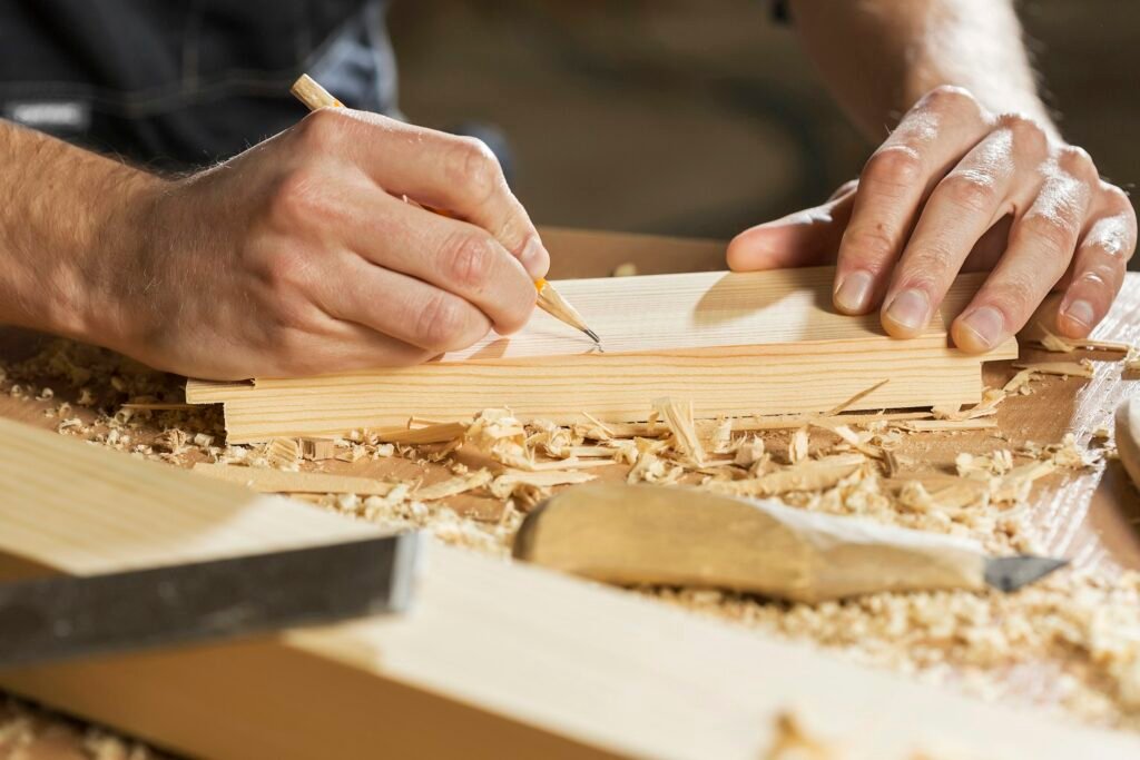 Production drawing being marked out on a board before cutting and boring